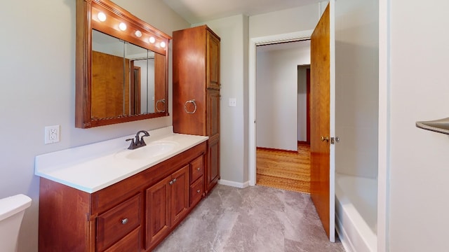 9170 Storey Rd, North East, PA 16428 - full bath featuring vanity, toilet, a tub to relax in, and baseboards