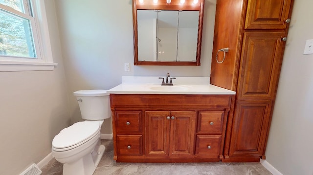 9170 Storey Rd, North East, PA 16428 - bathroom featuring baseboards, toilet, and vanity