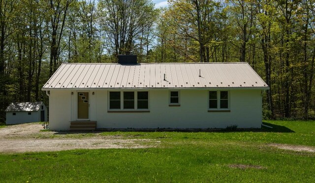 9170 Storey Rd, North East, PA 16428 - view of front of house featuring entry steps, a front yard, and metal roof