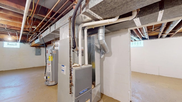 9170 Storey Rd, North East, PA 16428 - basement with gas water heater, plenty of natural light, electric panel, and heating unit