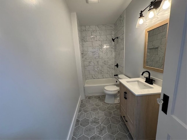 full bathroom featuring tiled shower / bath combo, vanity, and toilet