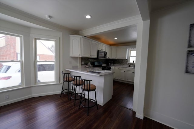 living room with a fireplace and dark hardwood / wood-style flooring