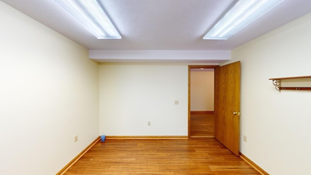 spare room featuring light hardwood / wood-style floors