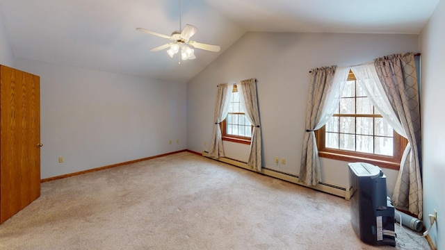 carpeted empty room featuring ceiling fan, a healthy amount of sunlight, lofted ceiling, and a baseboard heating unit