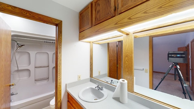 full bathroom featuring vanity,  shower combination, and toilet