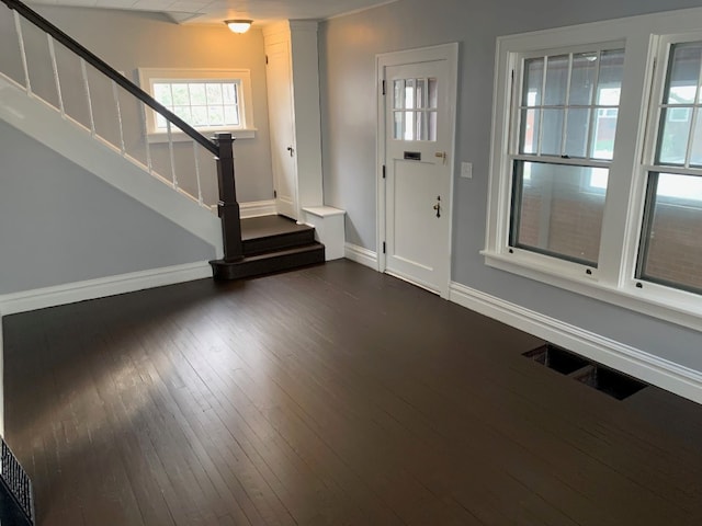 entrance foyer featuring dark wood-type flooring