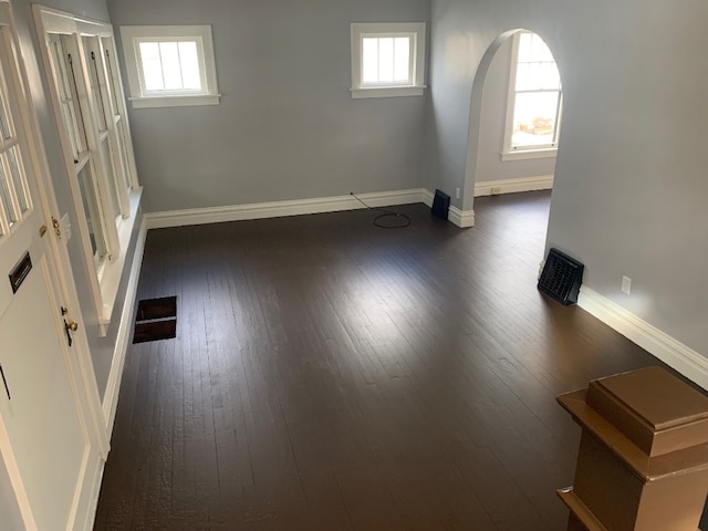 unfurnished room featuring dark hardwood / wood-style floors