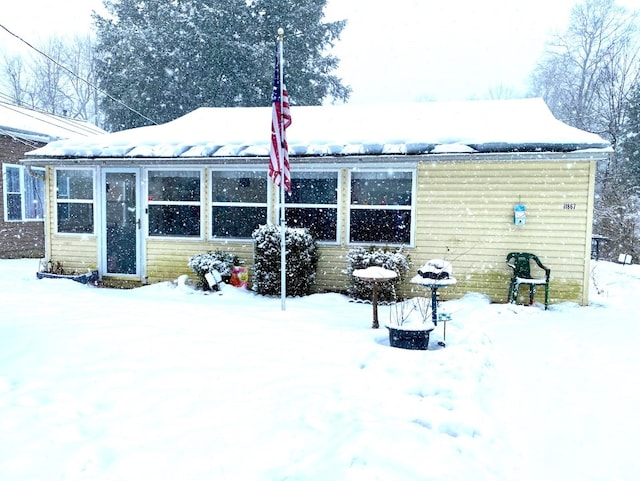 view of snow covered house