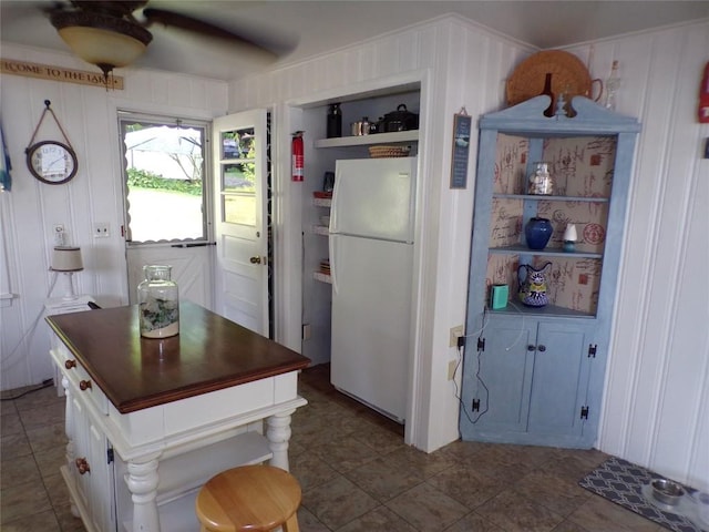 179 Elk Creek Rd, Lake City Boro, PA 16423 - kitchen with freestanding refrigerator, ceiling fan, open shelves, dark countertops, and tile patterned floors