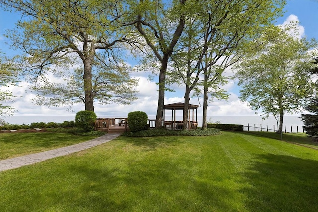 view of yard featuring a gazebo and a water view