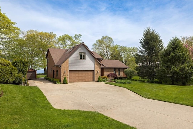 view of front of house with a front yard and a garage