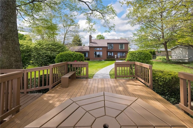 wooden deck with a lawn