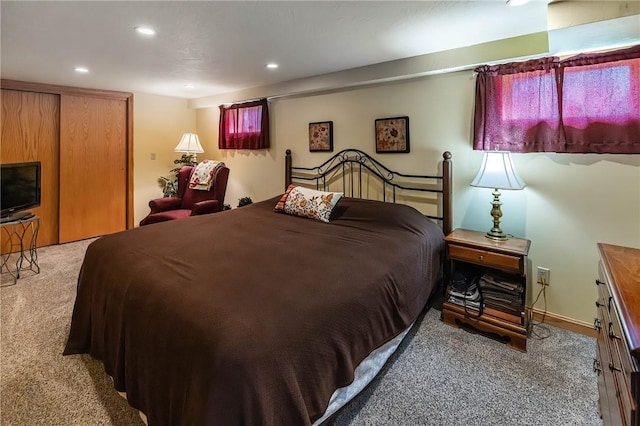 bedroom with a closet and carpet floors