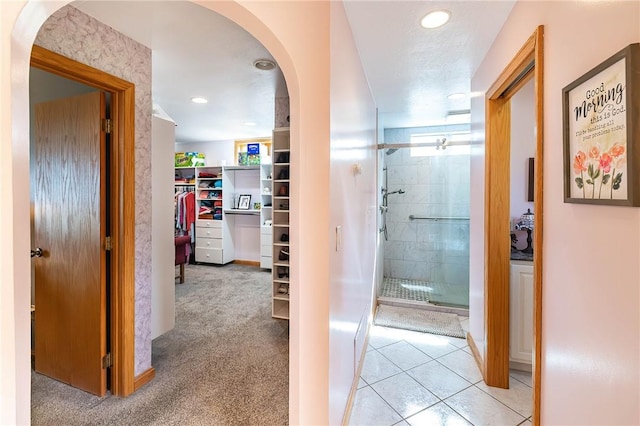 hallway with light colored carpet