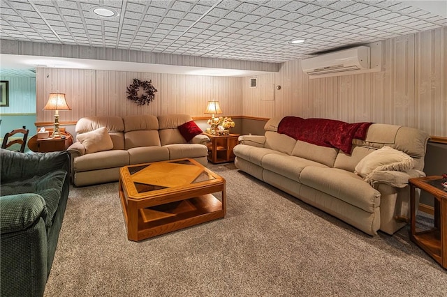 carpeted living room featuring an AC wall unit and wood walls