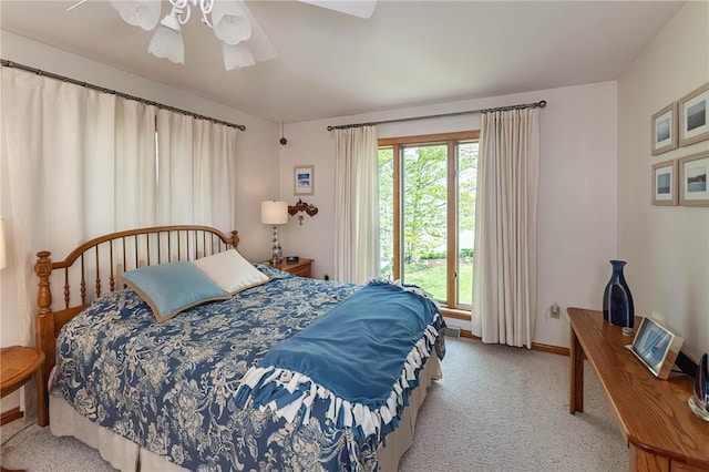 bedroom featuring ceiling fan and light colored carpet