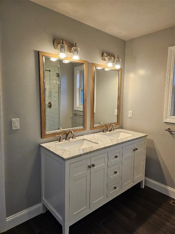 bathroom with hardwood / wood-style floors and vanity