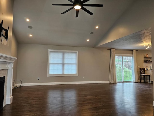 unfurnished living room with a tile fireplace, dark hardwood / wood-style flooring, high vaulted ceiling, and ceiling fan