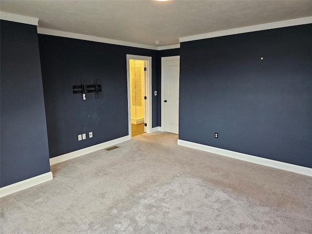 carpeted empty room with crown molding