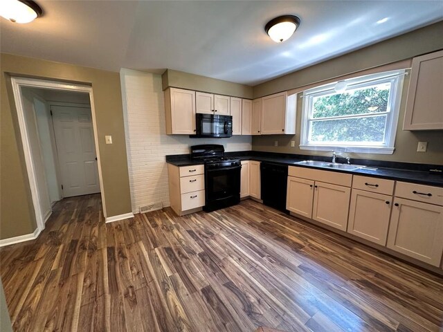 3010 Oakwood St, Erie, PA 16508 - kitchen featuring black appliances, dark wood-style flooring, and dark countertops