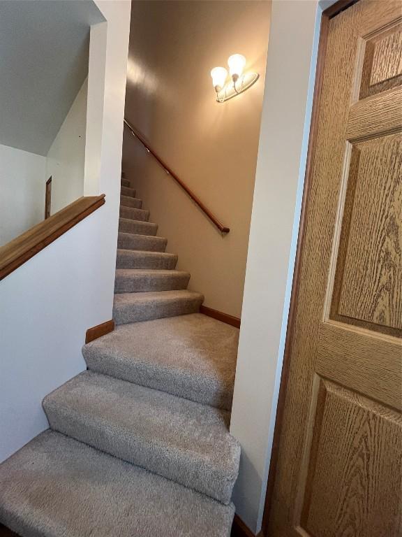 234 Walnut St Unit 13, Meadville, PA 16335 - stairway featuring carpet floors