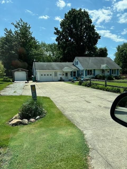 1233 Gunton Dr, Fairview, PA 16415 - ranch-style home with driveway, a front yard, and a garage