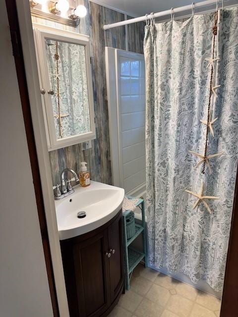 bathroom featuring tile patterned floors, vanity, and shower / tub combo with curtain