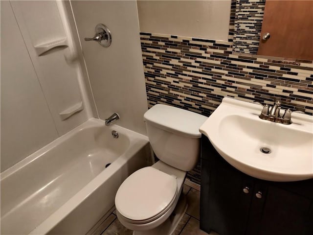 full bath featuring toilet, tasteful backsplash, and vanity