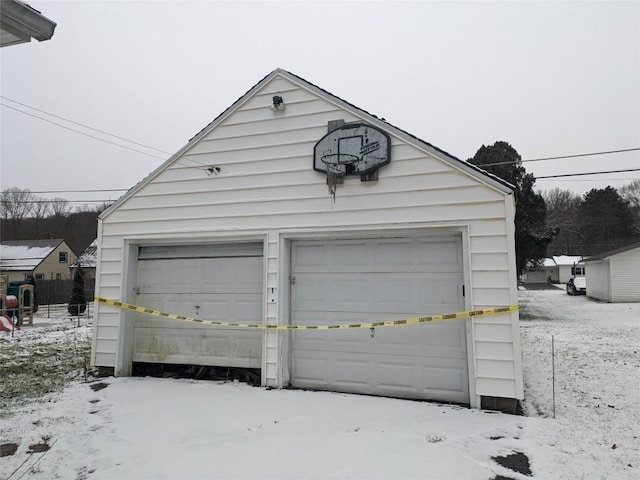 view of snow covered garage