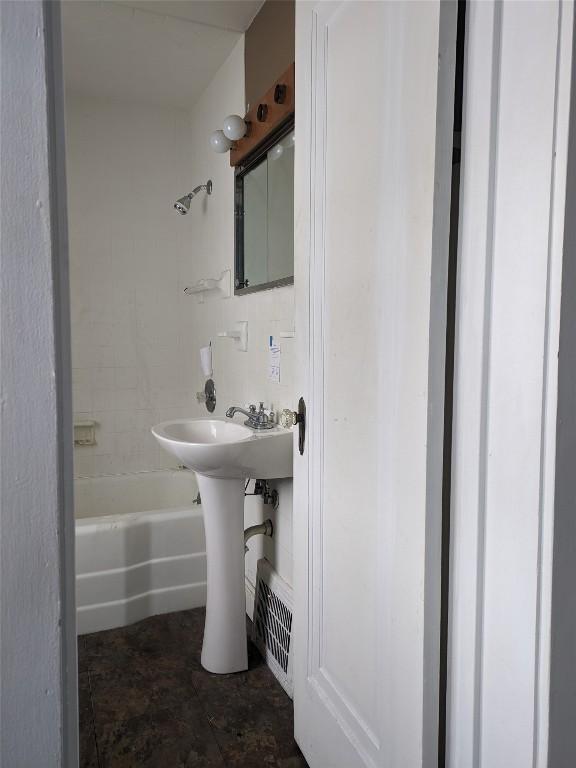 bathroom with shower / tub combination