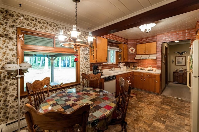 dining space with a chandelier, ornamental molding, a baseboard heating unit, and sink