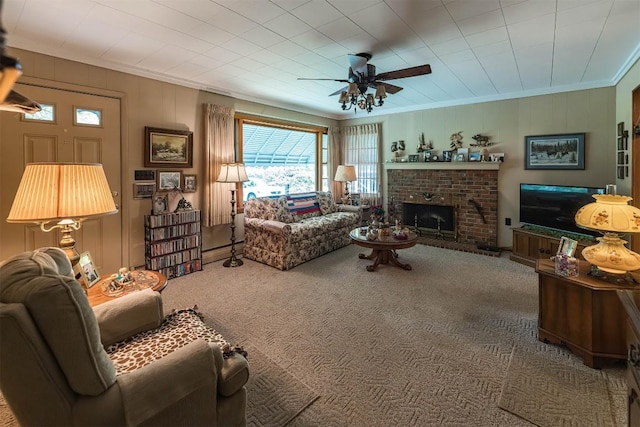 carpeted living room with a brick fireplace, ceiling fan, and ornamental molding