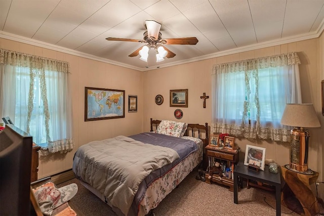 bedroom with multiple windows, ceiling fan, and crown molding