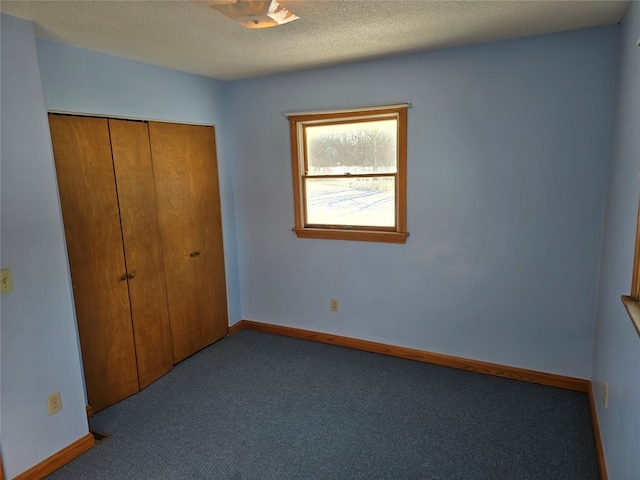 unfurnished bedroom featuring light carpet and a closet