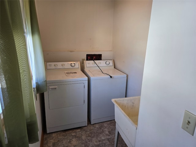 clothes washing area featuring washing machine and dryer