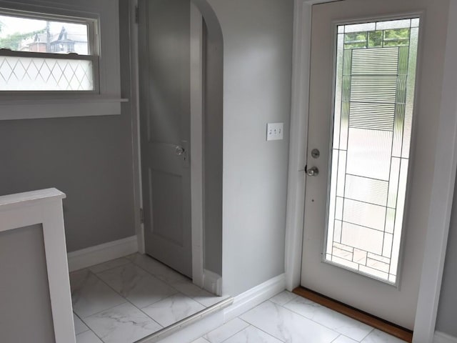 221 Locust St, Meadville, PA 16335 - doorway to outside featuring marble look tiles, arched walkways, and plenty of natural light
