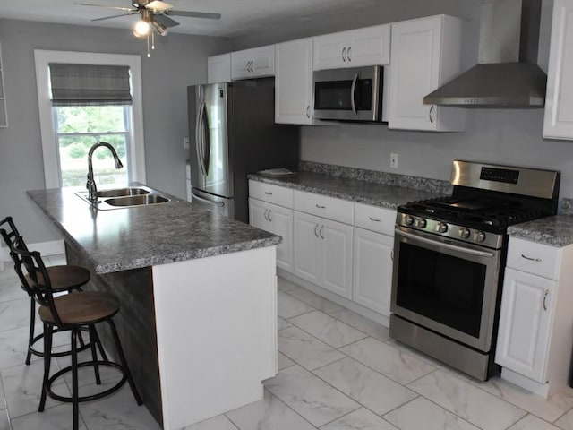 221 Locust St, Meadville, PA 16335 - kitchen with appliances with stainless steel finishes, wall chimney range hood, light marble finish floors, and ceiling fan