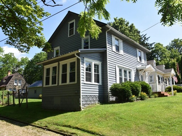 221 Locust St, Meadville, PA 16335 - view of side of home featuring a yard