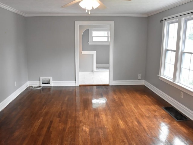 221 Locust St, Meadville, PA 16335 - spare room featuring wood finished floors, a ceiling fan, ornamental molding, and arched walkways