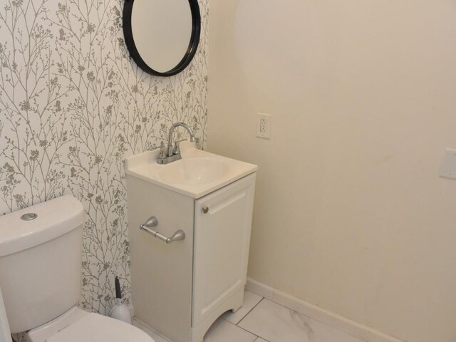 221 Locust St, Meadville, PA 16335 - bathroom with wallpapered walls and vanity