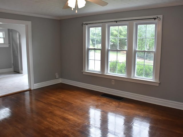 221 Locust St, Meadville, PA 16335 - unfurnished room with a ceiling fan, wood finished floors, arched walkways, and crown molding