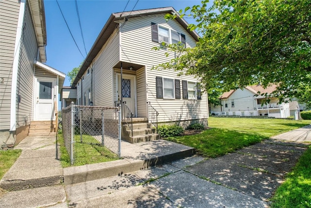 346 E 2nd St, Erie, PA 16507 - view of front of property featuring entry steps and a front lawn