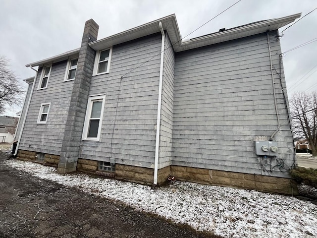 view of side of property featuring a chimney