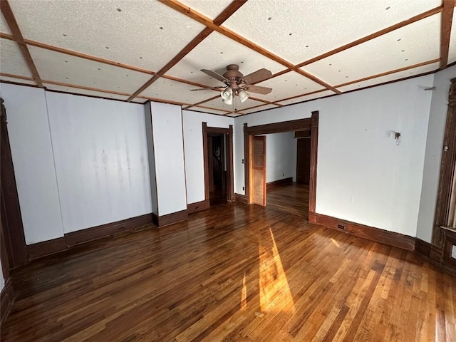 interior space with dark hardwood / wood-style floors, ceiling fan, and coffered ceiling