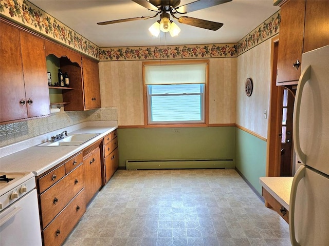 kitchen with open shelves, white appliances, ceiling fan, a baseboard heating unit, and a sink