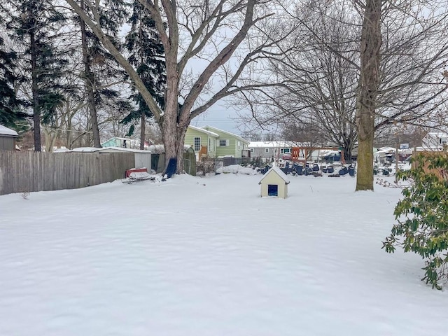 view of yard layered in snow