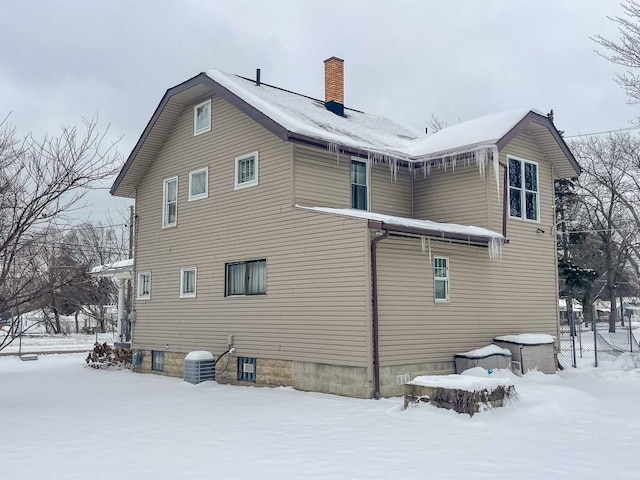 view of snow covered house