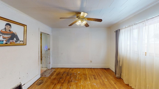 interior space featuring light hardwood / wood-style floors, ceiling fan, and crown molding