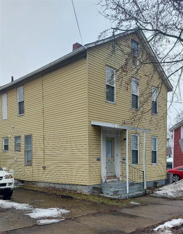 view of front of property with a chimney