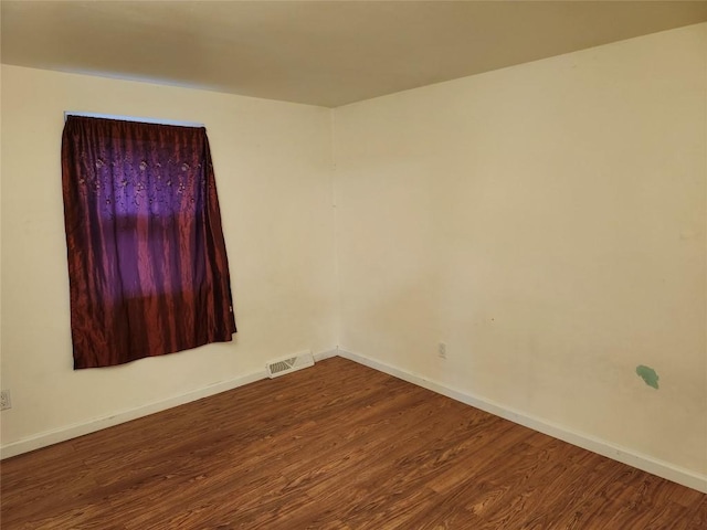 unfurnished room featuring hardwood / wood-style flooring